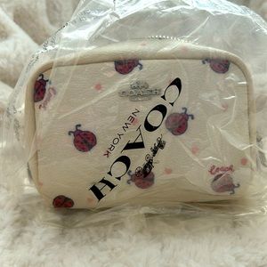 NWT Coach lady bug mini cosmetic bag. New lower price!!  Short time only!